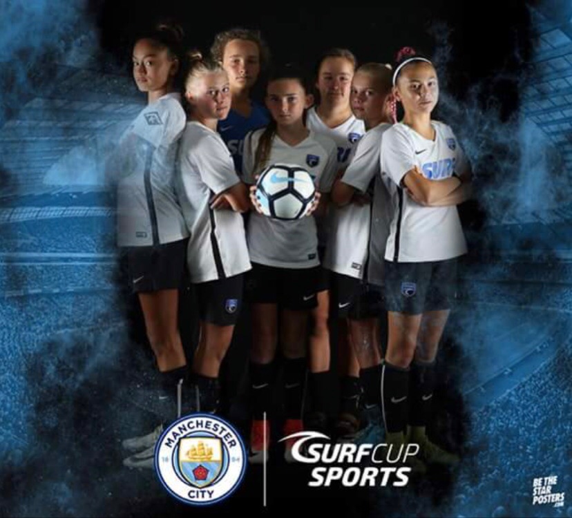 Girls from across the Surf Network posing for the photo booth at Man City Cup